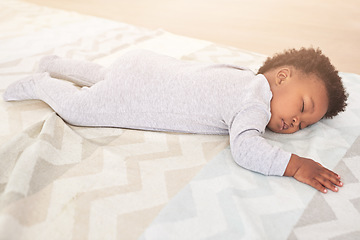 Image showing Bedroom, cute and baby sleeping in home on blanket for rest, nap time and dreaming in nursery. Childcare, newborn and cute, tired and African child in bed sleep for comfortable, relaxing and calm
