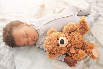 Image showing Sleeping, teddy bear and toy with baby in bedroom for carefree, development and innocence. Dreaming, relax and comfortable with african infant in nursery at home for morning, resting and bedtime