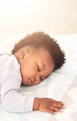 Image showing Cute, bed and baby sleeping in home on blanket for rest, nap time and dreaming in nursery. Childcare, newborn and adorable, tired and African child in bedroom sleep for comfort, relaxing and calm