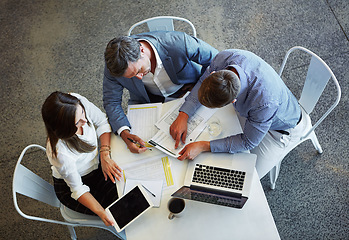 Image showing Top view, business and employees planning, documents and discussion for review, feedback or partnership. Staff, group or coworkers check paperwork, conversation or collaboration with ideas or talking