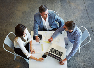 Image showing Top view, staff and group planning, brainstorming and conversation for growth, development and teamwork. Employees, coworkers and business people share ideas, laptop and discussion with collaboration