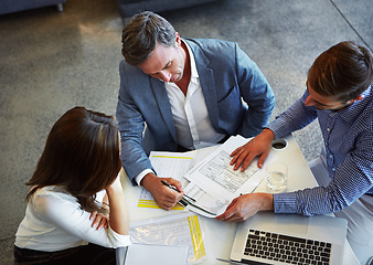 Image showing Top view, business people and employees with documents, planning and collaboration in the workplace. Staff, group or coworkers brainstorming, paperwork or teamwork in a meeting, new project and ideas