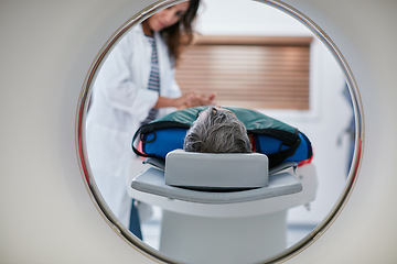 Image showing Doctor, ct scan and woman comfort patient in hospital before scanning in machine. Mri, holding hands and medical professional with senior female person in radiology test for healthcare in clinic.