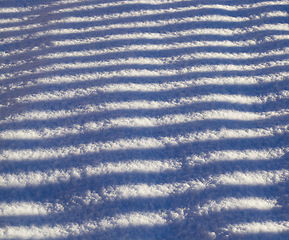 Image showing striped shadows on a Sunny day