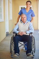 Image showing Portrait, caregiver or old man in wheelchair in hospital helping an elderly patient for support in clinic. Happy, medical nurse or healthcare social worker talking to a senior person with disability