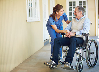 Image showing Talking, happy caregiver or old man in wheelchair in hospital helping an elderly patient for support in clinic. Medical nurse or healthcare social worker speaking to a senior person with disability