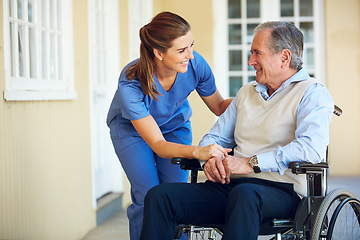 Image showing Speaking, happy caregiver or old man in wheelchair in hospital helping an elderly patient for support in clinic. Medical nurse or healthcare social worker talking to a senior person with disability