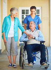 Image showing Wife, caregiver or old man talking in wheelchair in hospital clinic helping an elderly patient for support. Disabled, couple or trusted healthcare nurse speaking with senior people with a disability