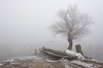 Image showing traditional fishing boats on river Danube mid winter