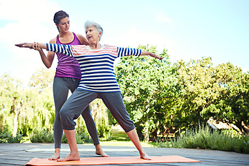 Image showing Nature, senior woman and yoga coach teaching exercise, coaching retirement workout or outdoor fitness. Personal trainer, wellness instructor and old person, yogi or people learning pilates training