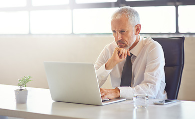 Image showing Laptop, thinking and strategy with a business man in the office, working online to finish a project at his desk. Computer, idea and email with a mature male manager at work for company research