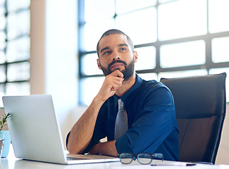 Image showing Laptop, thinking and future with a business man in the office, working online to finish a project at his desk. Computer, idea and planning with a young male employee at work for company vision