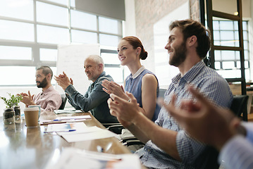 Image showing Meeting, success and applause with a business team in the boardroom in celebration of a target or goal. Collaboration, teamwork and support with a group of employee colleagues clapping in the office