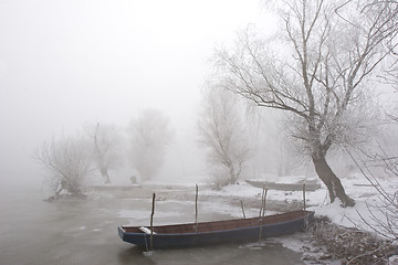 Image showing traditional fishing boats on river Danube mid winter