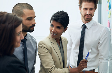 Image showing Business woman, manager and group at whiteboard talking about a seo and innovation plan. Working, communication and management of a female executive with writer team looking at web content trends