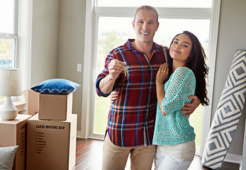 Image showing Real estate, keys and new home or couple hug for mortgage or property buy and happy portrait together with boxes in lounge. Apartment, man and woman excited for rent or in love or embrace for move