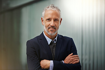 Image showing Portrait, vision and arms crossed with a corporate man in his office, looking happy about his company growth. Mission, mindset and confidence with a senior male business manager standing at work