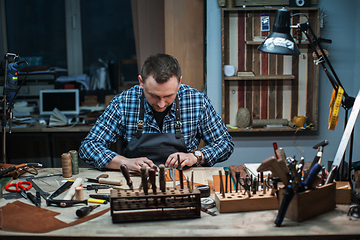 Image showing Concept of handmade craft production of leather goods.