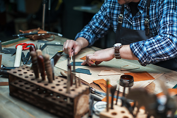 Image showing Concept of handmade craft production of leather goods.