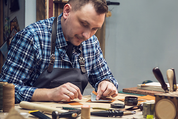 Image showing Concept of handmade craft production of leather goods.