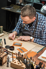 Image showing Concept of handmade craft production of leather goods.