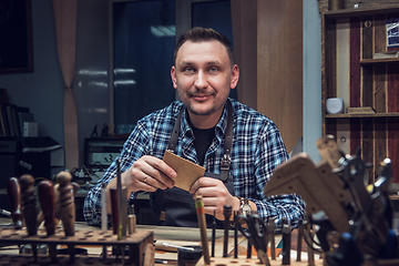 Image showing Concept of handmade craft production of leather goods.