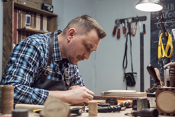 Image showing Concept of handmade craft production of leather goods.