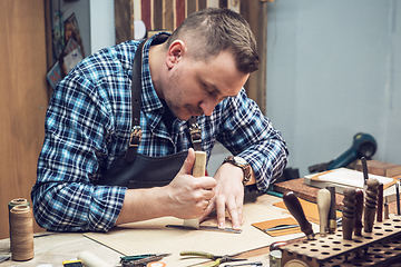 Image showing Concept of handmade craft production of leather goods.