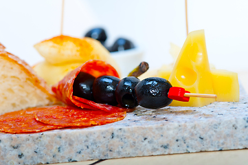 Image showing mix cold cut on a stone with fresh pears