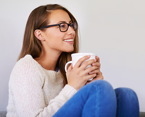 Image showing Thinking, coffee and smile of woman in living room home enjoying caffeine, espresso or cappuccino. Happiness, tea and female person with idea in lounge, drinking latte beverage and relax in house.