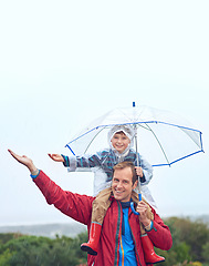 Image showing Rain, umbrella and father with child for family portrait outdoor for fun, happiness and quality time. Man and boy kid in nature with hand to catch water drops for freedom, learning and play or mockup