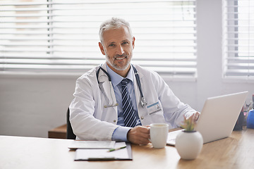 Image showing Healthcare, laptop and portrait of male doctor in his office analyzing online test results in a hospital. Happy, smile and professional mature man or medical worker working on a computer in a clinic