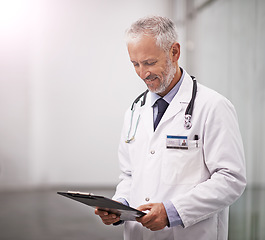 Image showing Healthcare, doctor and man reading clipboard with test results in hospital with health insurance mockup space. Professional male medical worker happy with document for consultation schedule or notes