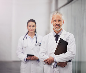 Image showing Healthcare, doctor and portrait of a happy man in a hospital with clinic space for health insurance. Senior chief and medical worker or woman together for a consultation, healing and wellness