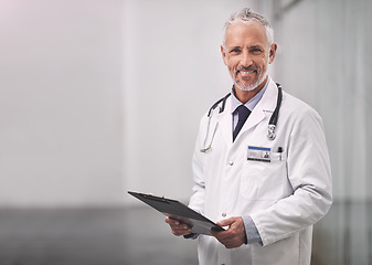 Image showing Doctor, healthcare and portrait of a happy man in a hospital with mockup space for health insurance. Professional male medical worker with a stethoscope and clipboard for results, healing or wellness