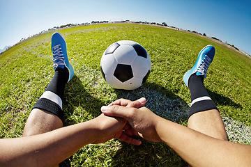 Image showing Sport, pov and shoes of man with soccer ball outdoor, relax and resting after fitness or training. Football, field and hands of male player relaxing on grass at park after workout, match or sports