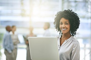 Image showing Black woman in business, laptop with smile in portrait and technology with connectivity and success in workplace. Professional female person holding pc, pride with email communication and internet