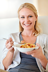 Image showing Happy woman, portrait smile and cereal for breakfast, morning meal or healthy diet in living room at home. Female person smiling with food bowl of wheat or corn flakes for health, nutrition or fiber