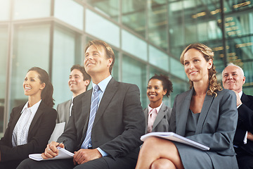 Image showing Business, group and seminar listen at an agency with a smile in the audience to learn. Professional, listening and together at a conference to plan a project during a conversation in the company.