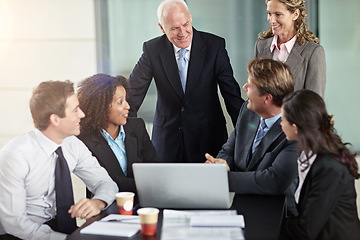 Image showing Corporate, ceo with funny joke in business meeting and in office sitting at desk with laptop. communication or planning, cooperation and teamwork or collaboration laughing with coworkers at work