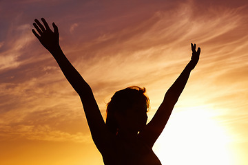 Image showing Silhouette, sunset and woman open arms and freedom outdoor, orange sky with fresh air and celebrate life. Meditation, wellness and peace in nature with shadow, female person with healthy mindset