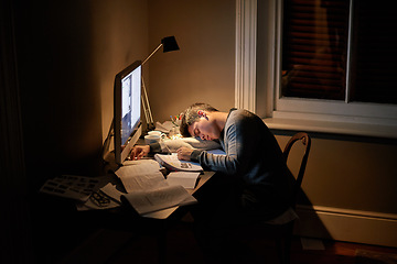 Image showing Student, university and sleeping or studying late into the night on screen or fatigue on table and reading for examination. Tired, research and hard work for test paper or computer at college