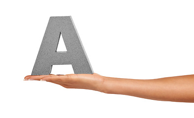 Image showing Alphabet, studio and a hand with capital letter A for learning, advertising or font. Woman show or holding sign, character or text for communication, typo and grammar isolated on a white background