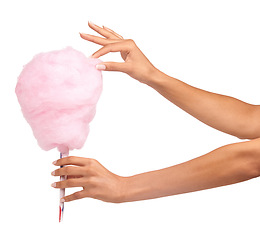 Image showing Cotton candy, closeup and woman hands isolated on a white background for sweets, pink food and holiday treat. Person hand holding soft, color cone for youth party, childhood and festival in studio