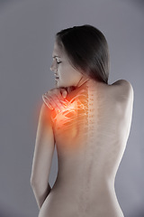 Image showing Woman, shoulder pain or back injury in studio while frustrated, burnout or experience health problem. Female person massage red anatomy glow, spine accident or scoliosis backache on a grey background