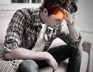 Image showing Man, headache and stress on home sofa while depressed, burnout and suffering with mental health or pain. Male person with red glow for fatigue, anxiety and brain fog or mistake while tired on a couch