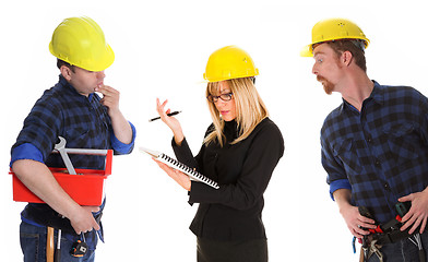 Image showing angry businesswoman and construction workers 