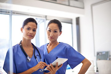 Image showing Female nurses, focus and digital tablet or healthcare planning or wellness analysis and portrait in hospital. Team, collaboration and women doctors or diagnosis or medical result and clinic