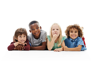 Image showing Smile, diversity and children or face on the floor together or against a white background and friends hug. Smile, kids and playful or laughing and isolated in studio or excited buddies and embrace