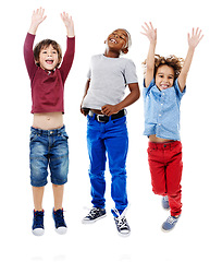 Image showing Students, jumping and portrait of children in studio for diversity, friends and playing. Happiness, youth and smile with group of kids isolated on white background for celebration, playful and energy